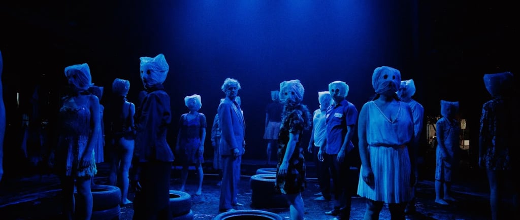 a group of mannequins in a stage setting