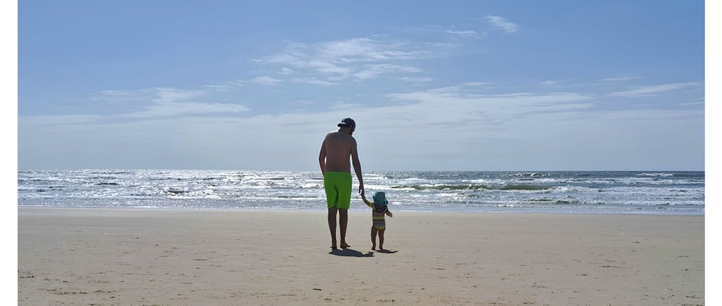 a man and his dog on the beach