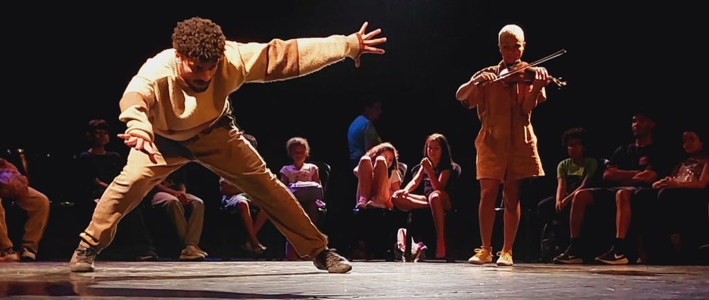 a man in a yellow shirt is performing a dance
