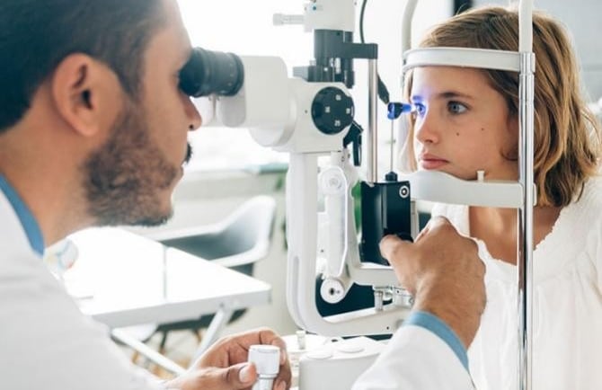 girl looking in machine
