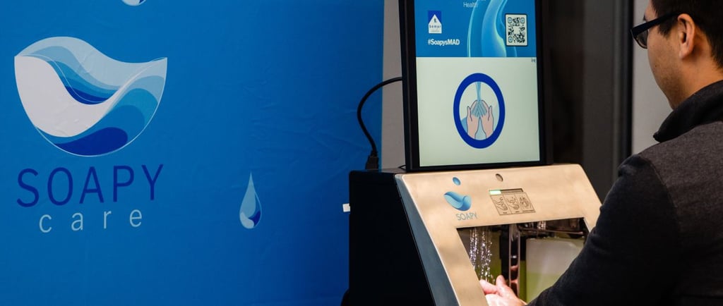 a man standing in front of a screen with a barcoder