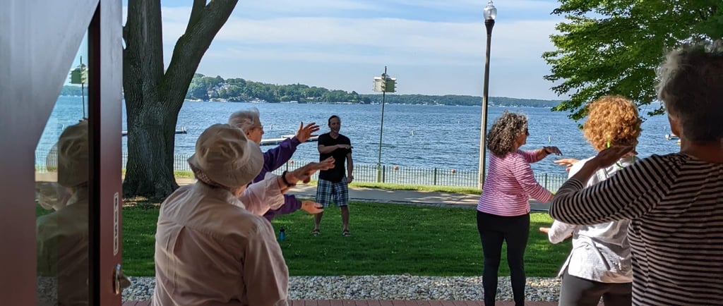Johnny sharing Tai Chi outdoors at the Lake Geneva Public Library