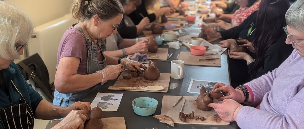 Commuinty Project - Group of people at into Bodmin creating clay pottery hens