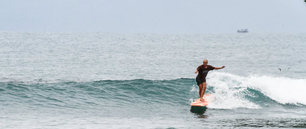 a man is surfing on a wave in the ocean