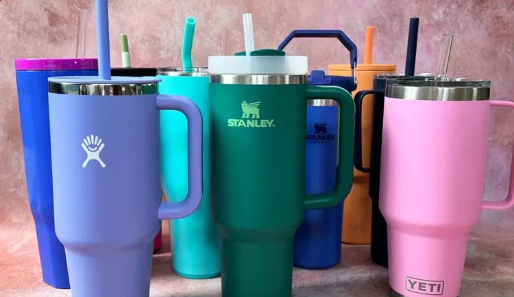 a variety of colorful colored mugs and tumblers