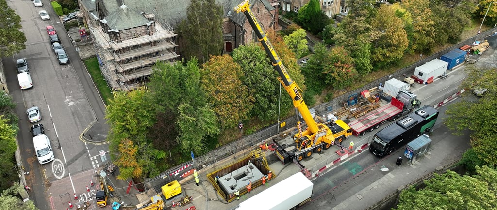 Aerial view of chamber cap being craned into spill chamber.