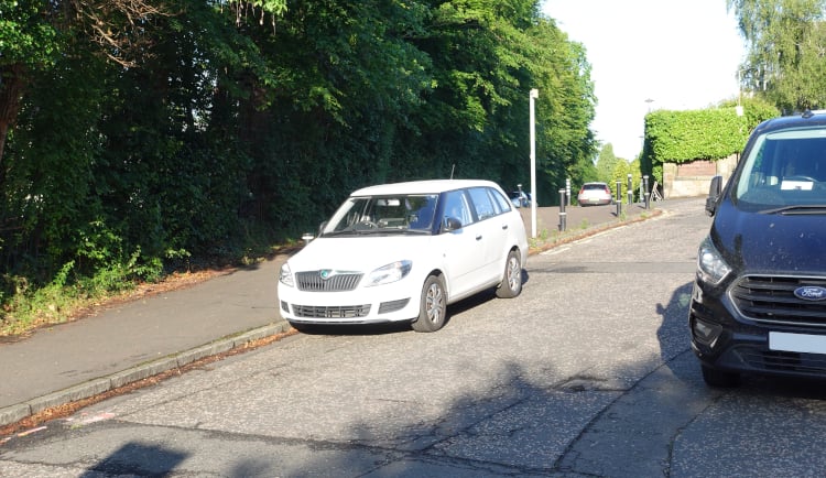 Cars parked at the bottom of Murrayfield Gardens