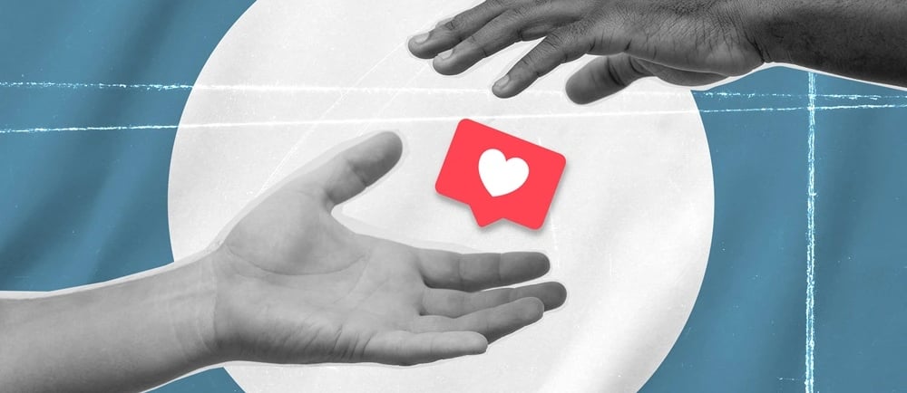 Duas mãos e o ícone de curtida do Instagram