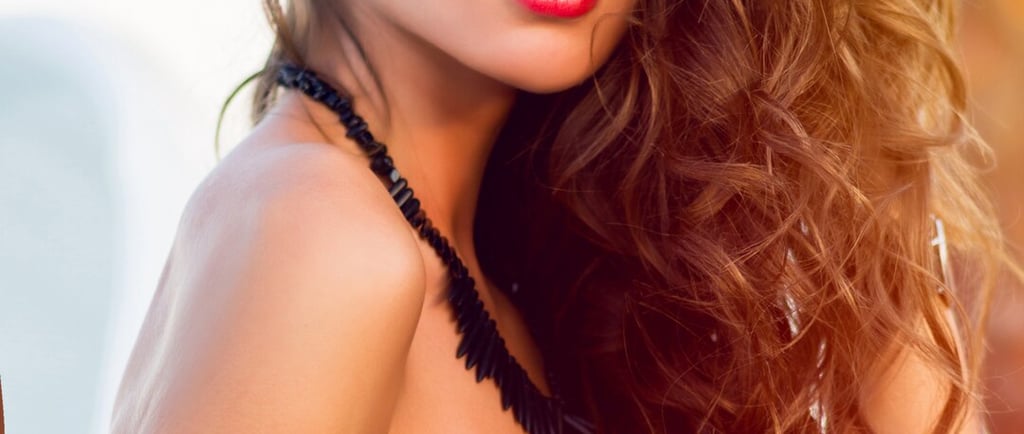 a woman in a bikini top and sunglasses