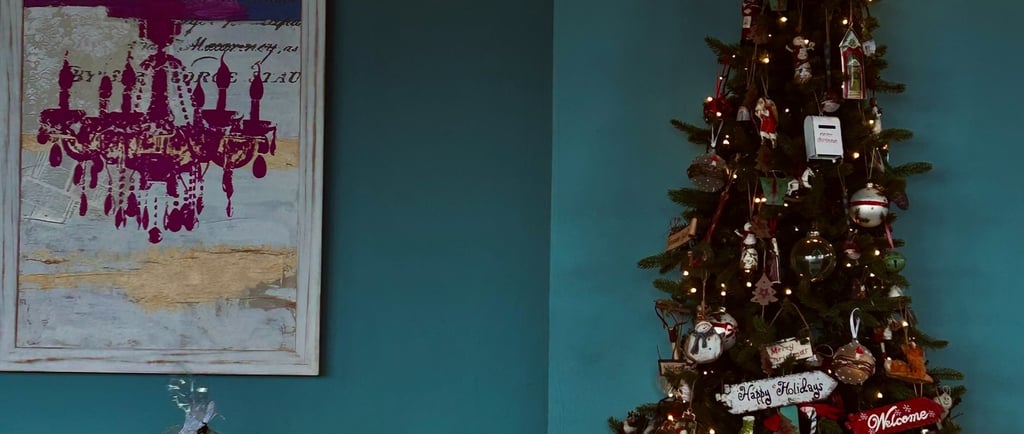a christmas tree with a clock on the wall