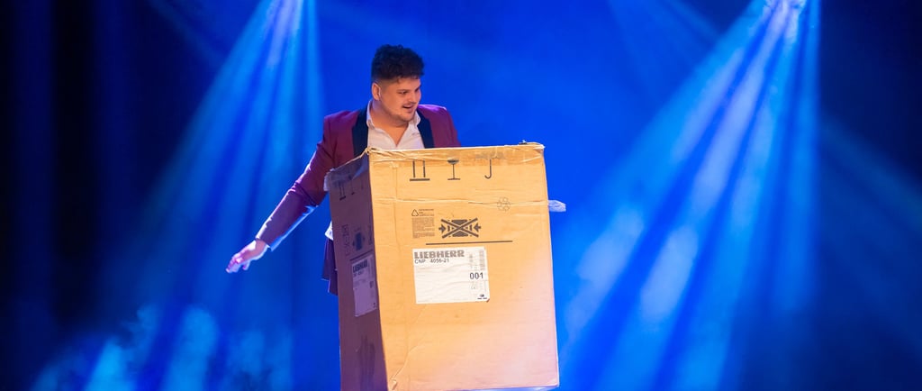 a man in a suit is holding a magic flying box