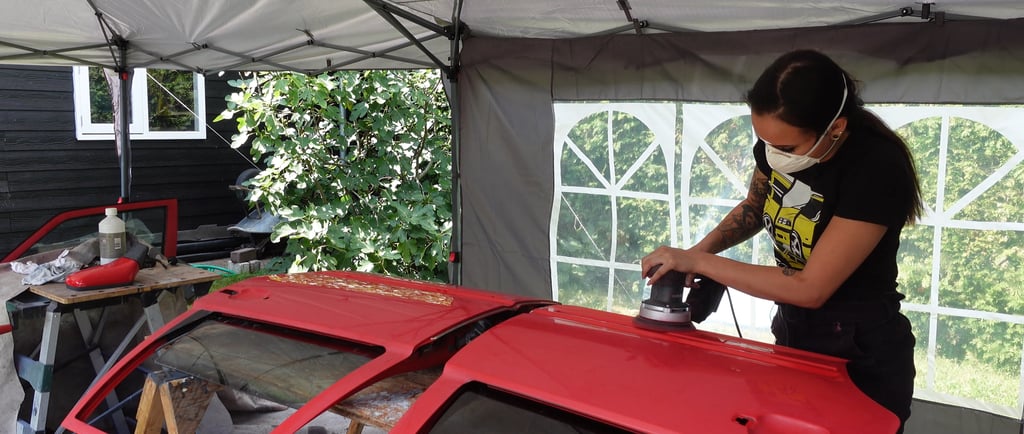 Joy van Haelen sanding her Volvo 850R door
