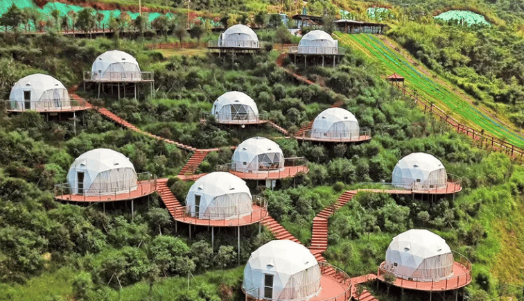 a group of tents with stairs leading to the top of them