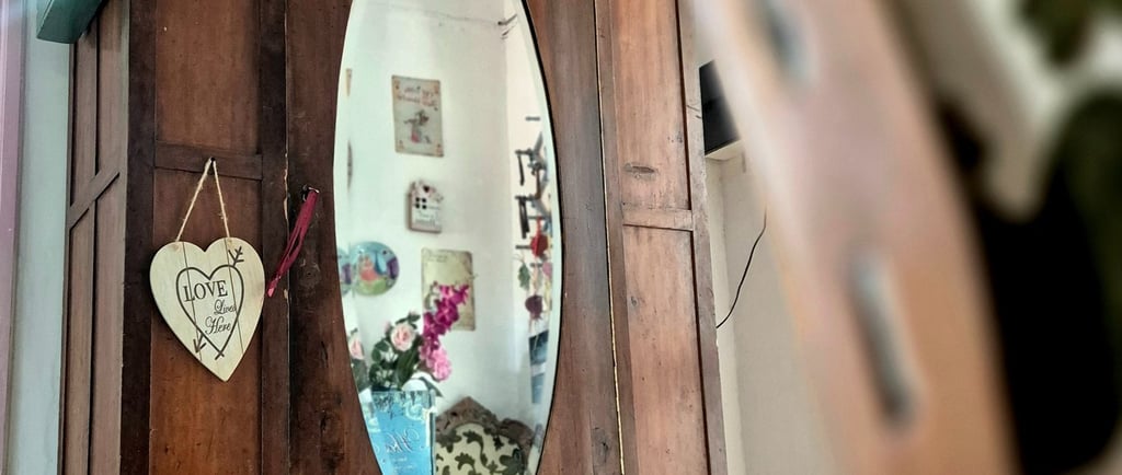 a mirror in a cabinet with hearts on it taken during a Cyprus tour
