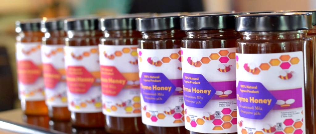 a row of jars of honeycomb honey
