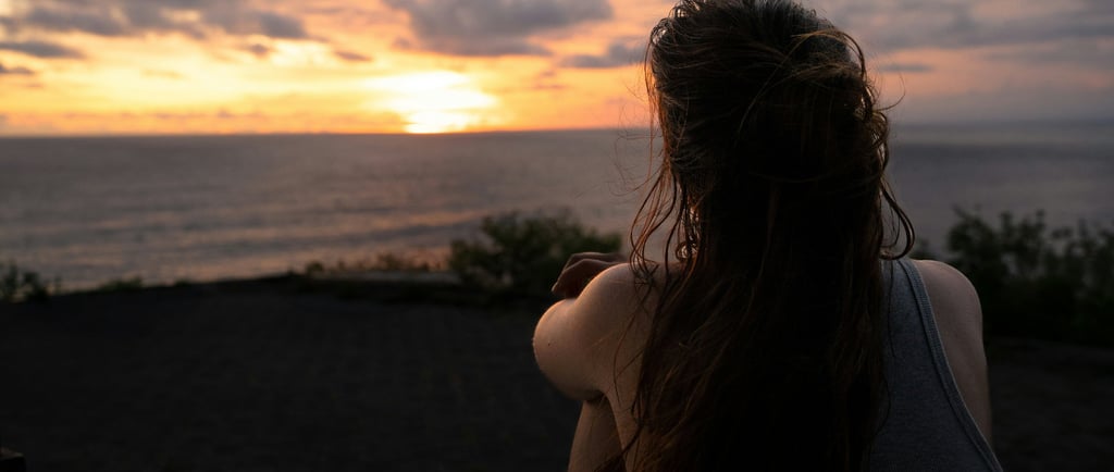 Young person reflecting on their future with a sense of calm and possibility.