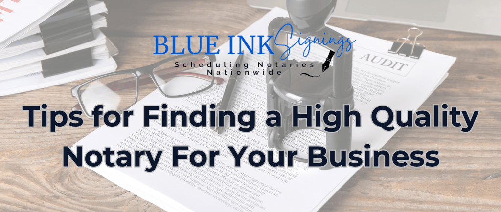 a desk with a pen and glasses on top of a desk with a laptop and