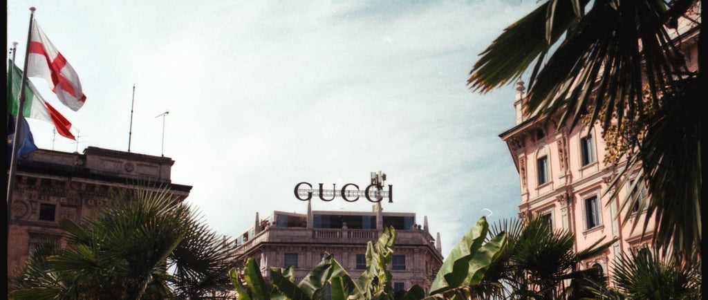 a large building with a large sign that says gucci