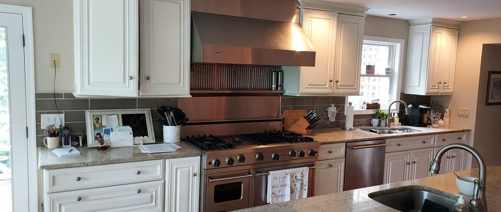 a kitchen with counter top and cabinets