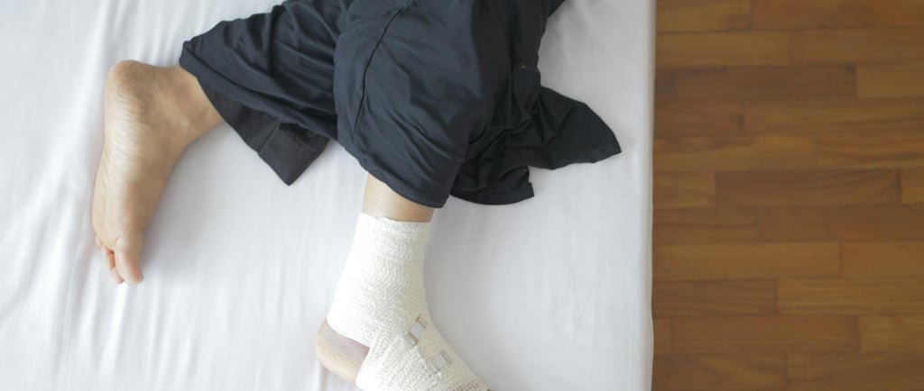 A man with bandage wrapped on his leg