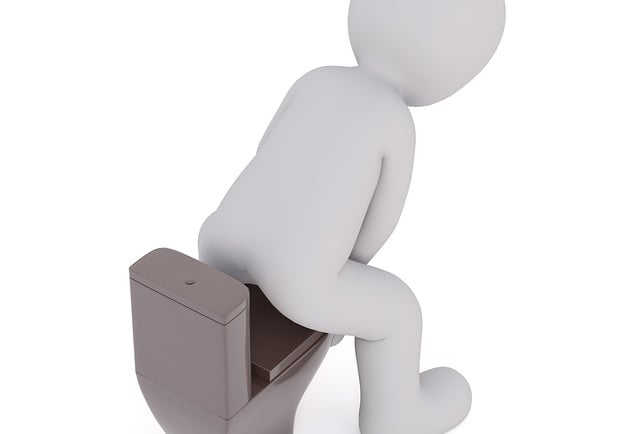 man on toilet with hemorrhoids