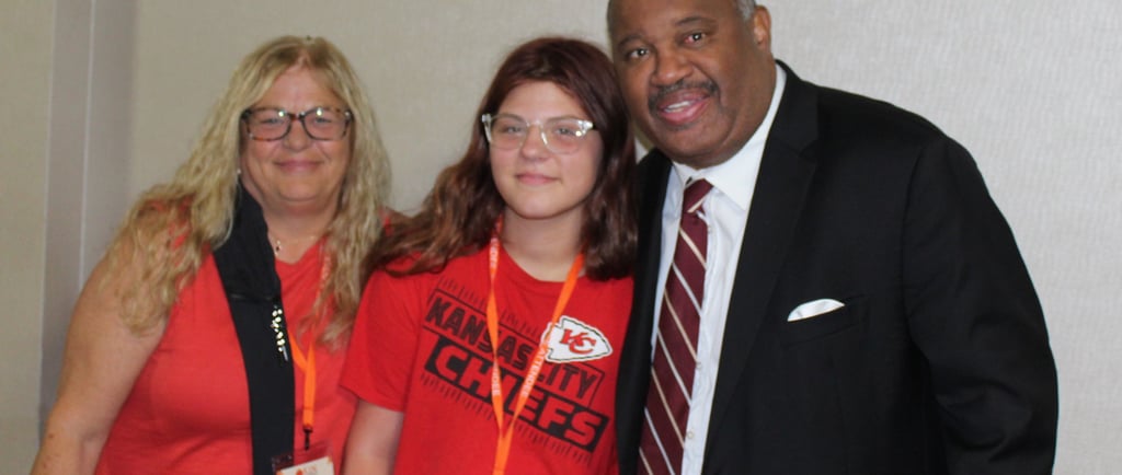 Dominic Carter with a family at a Missouri kinship care conference.