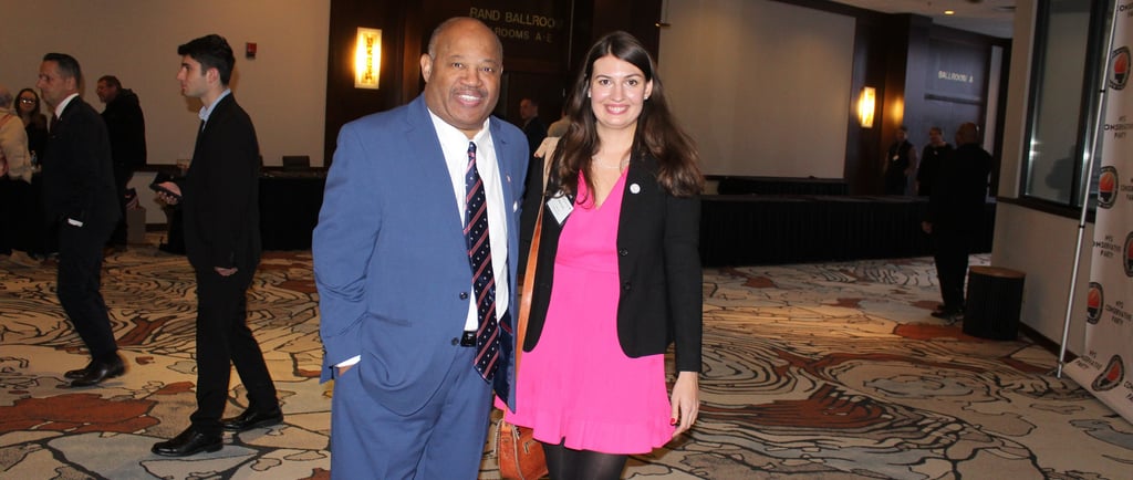 Dominic Carter speaking in Albany NY at a foster care conference, pictured with an attendee.
