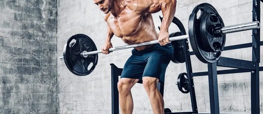 a man doing a barbell rowing