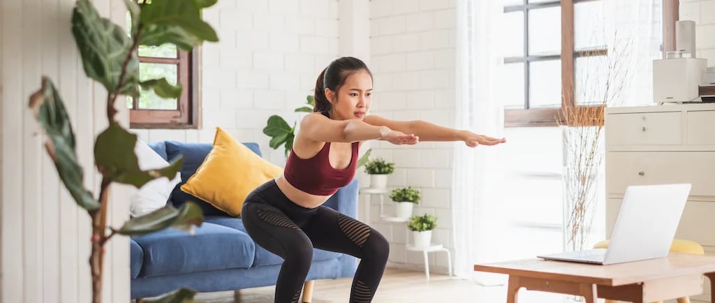 a woman doing yoga exercises on a yoga mat