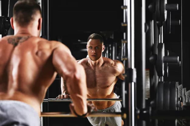 a man in a gym with a barbell