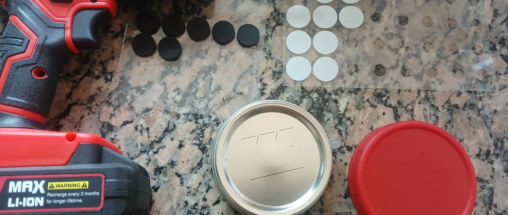 Mycology lid supplies set out on a table: blank jar lids, drill, self-healing injection ports, and f