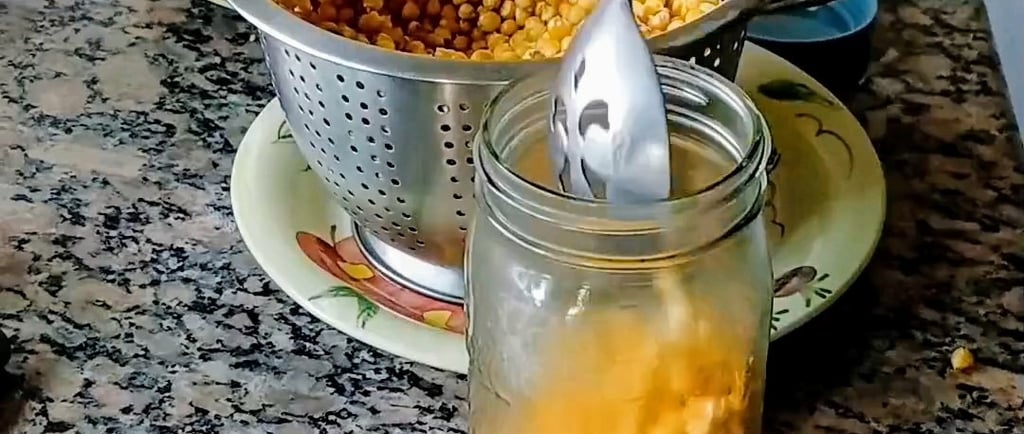 grain spawn being poured into a mason jar