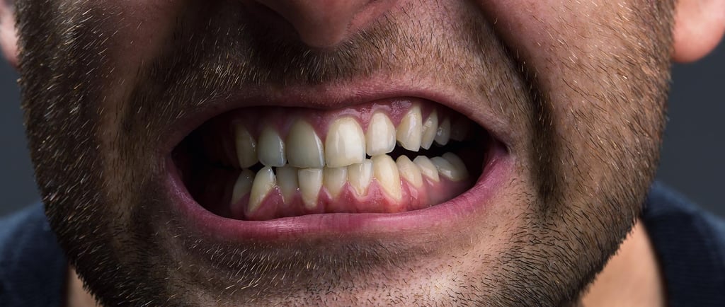 a image showing man clenching his teeth