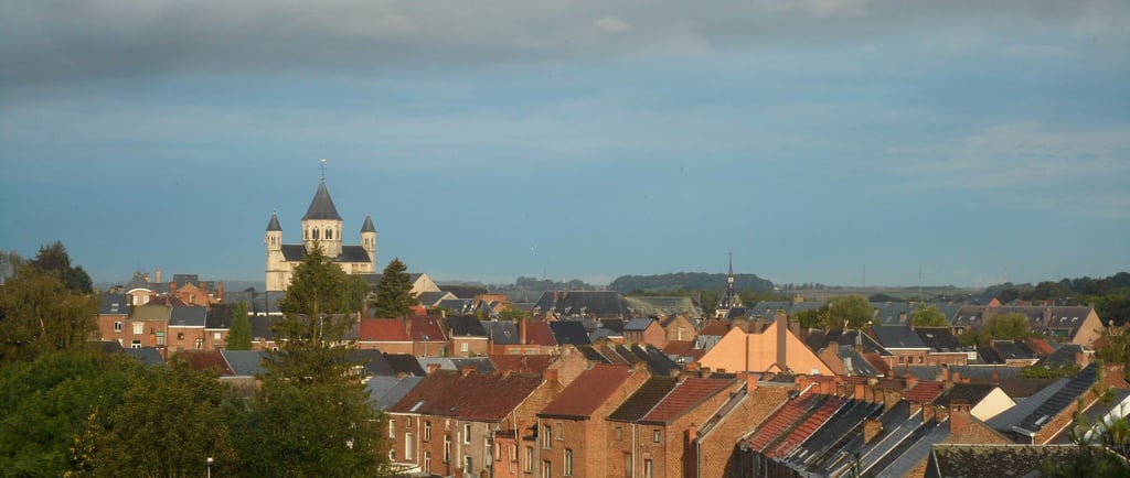 a church steeple with a clock tower in the background