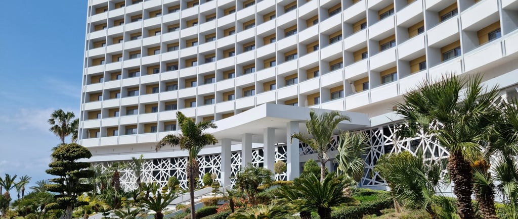 a large white building with a large white building in the background