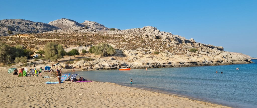 a beach with people on a sunny day