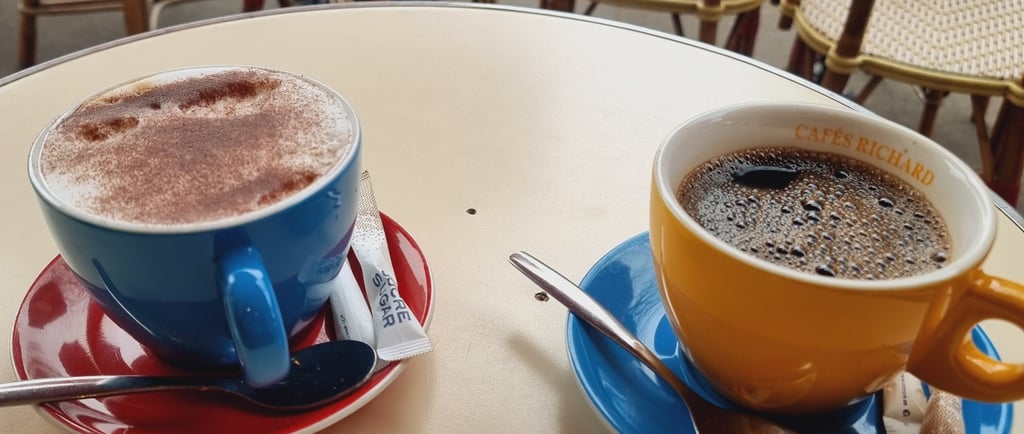 two cups of coffee and a sugar