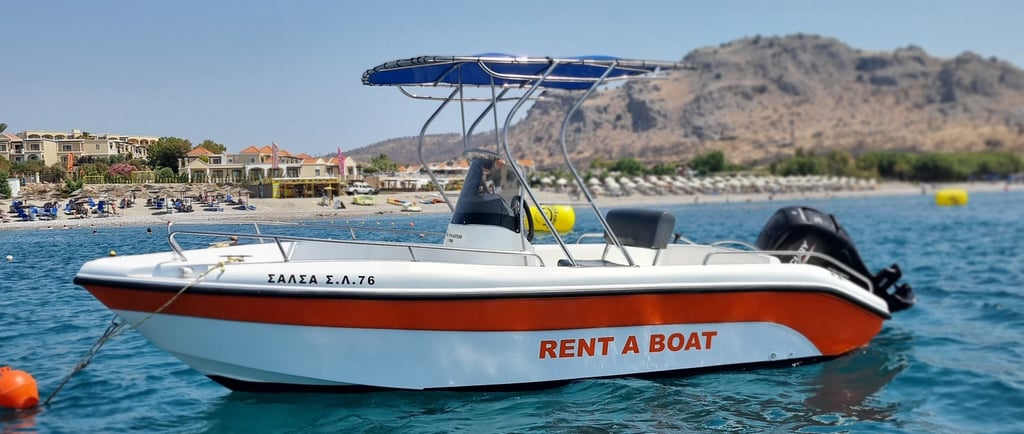 a boat with a red and white in the water