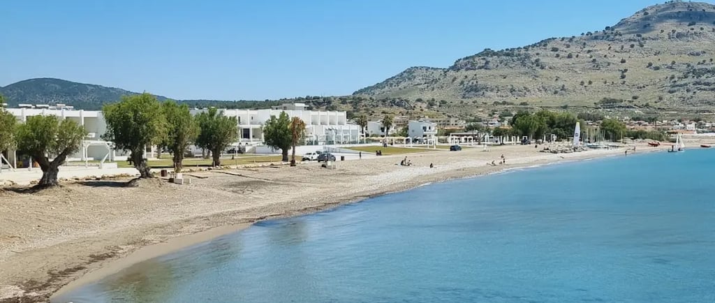 a beach with a mountain in the background