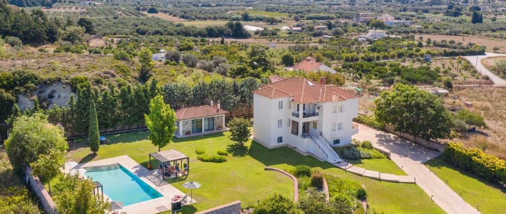 Luxury Greek villa rental with a private swimming pool and scenic mountain views in Rhodes.