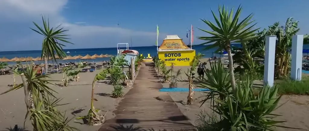 sandy beach in greece with sotos water sports beach house in faliraki