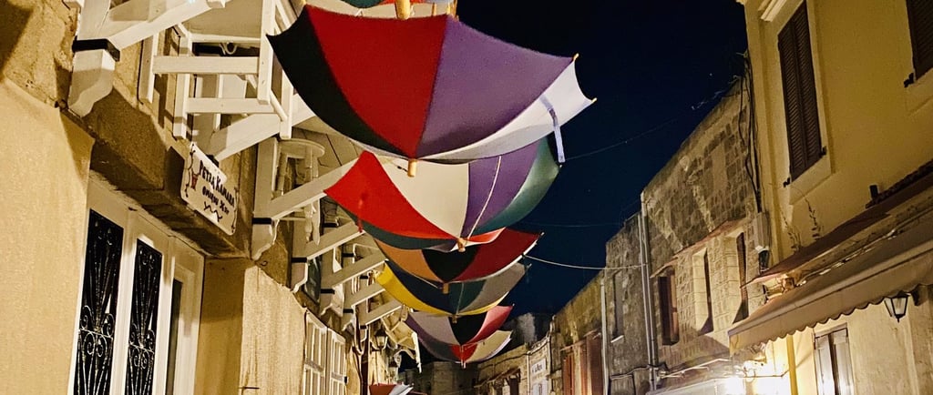 colorful umbrellas hanging upside down in rhodes old town