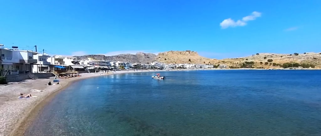 a beach with a boat in the water