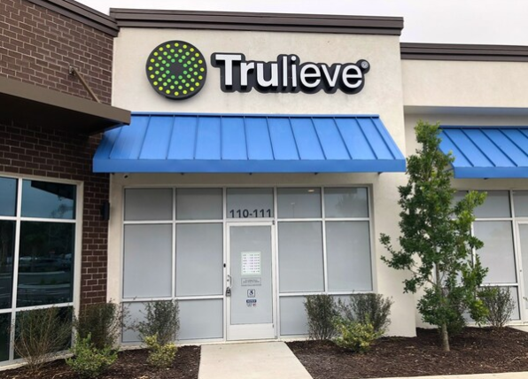 Trulieve storefront with a blue awning in Palm Coast, Florida.