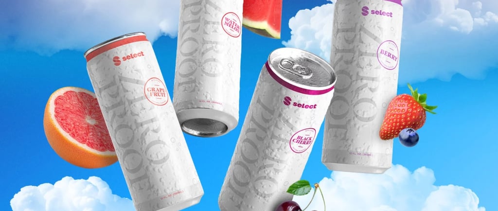 a group of three cans of soda cans with fruit on them