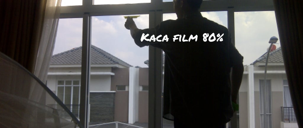 a man standing in front of a window with a window