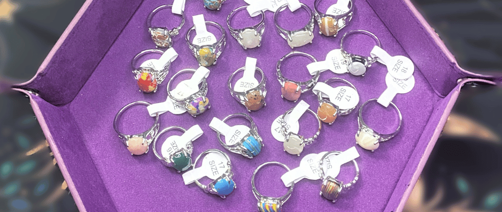 a collection of rings with a variety of colored stones