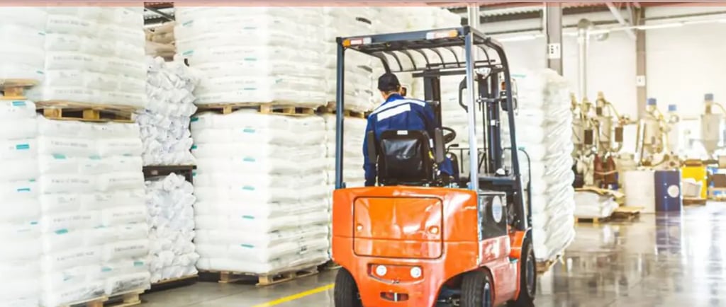 a forklift truck with a forklift truck in the background