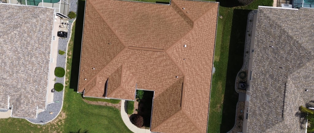 a house with a brown roof and a brown roof
