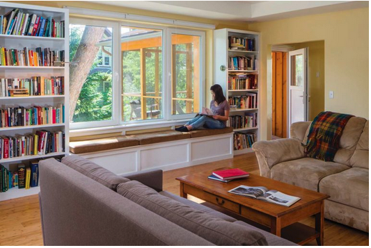 Window seat and shelving in the living room of a Passive House
